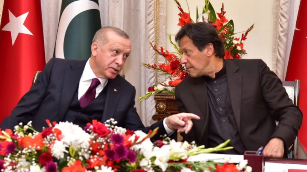 akistan''s Prime Minister Imran Khan and Turkish President Tayyip Erdogan share light moment during an agreement signing ceremony in Islamabad