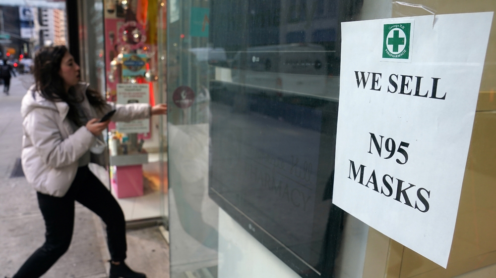 A woman walks into a pharmacy to purchase N95 face masks in advance of the potential coronavirus outbreak in the Manhattan borough of New York City, New York, U.S., February 27, 2020.
