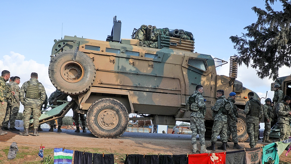 A Turkish military convoy is seen parked near the town of Batabu on the highway linking Idlib to the Syrian Bab al-Hawa border crossing with Turkey, on March 2, 2020. - The Syrian government pledged t
