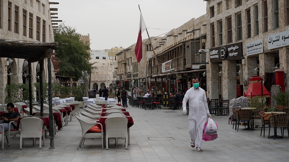 People wearing protective masks in Souq Waqif as the number of coronavirus cases has increased by 17 on, Doha, Qatar, Saturday, March 14, 2020 [Sorin Furcoi/Al Jazeera]