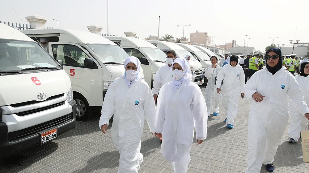 A team of doctors and nurses prepare themselves before heading out to their designated residential areas to check on residents who returned from Iran if anyone is infected with the novel coronavirus,