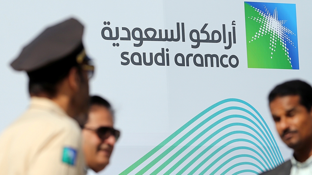 The logo of Aramco is seen as security personnel stand before the start of a press conference by Aramco at the Plaza Conference Center in Dhahran, Saudi Arabia November 3, 2019. REUTERS/Hamad I Mohamm