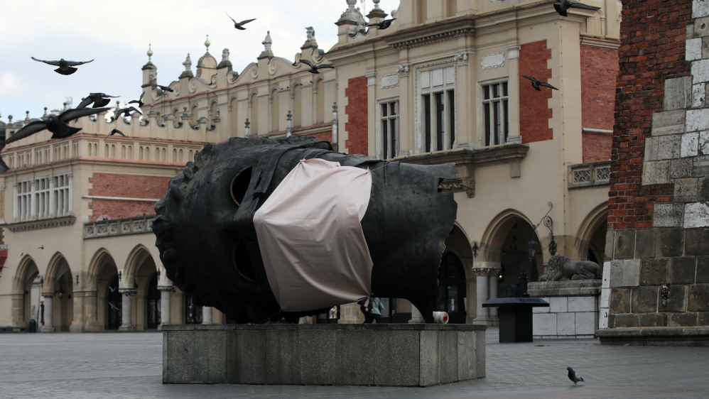 Poland coronavirus statue mask