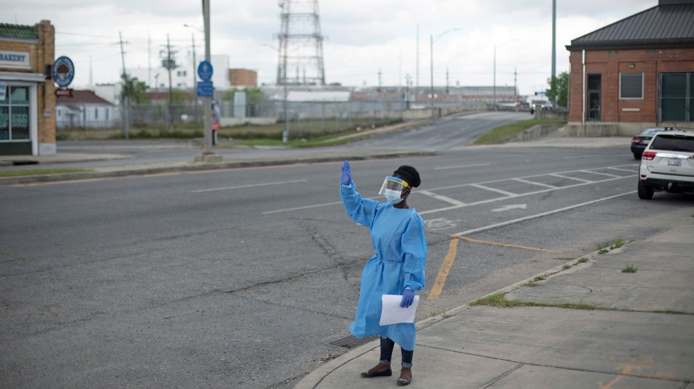 Drive-through testing facility for the coronavirus disease (COVID-19) in New Orleans A staff member of Odyssey House Louisiana (OHL)