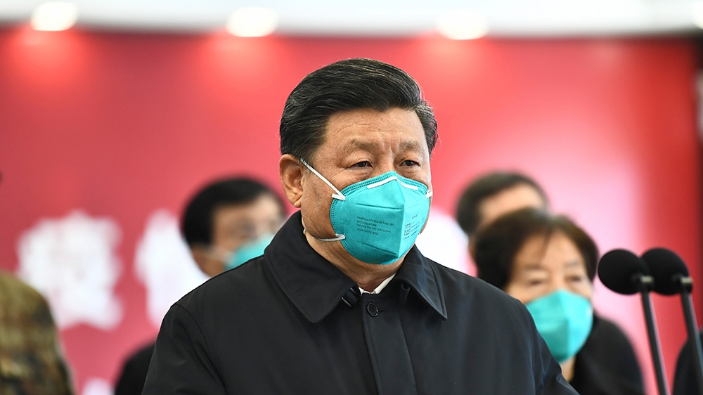 In this photo released by China’s Xinhua News Agency, Chinese President Xi Jinping talks by video with patients and medical workers at the Huoshenshan Hospital in Wuhan in central China’s Hubei Provin