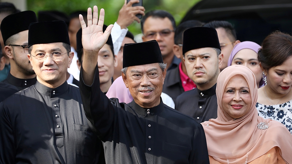 Malaysia''s Prime Minister Designate and former interior minister Muhyiddin Yassin waves to reporters before his inauguration as the 8th prime minister, outside his residence in Kuala Lumpur, Malaysia,