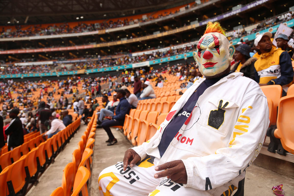Nkosana fan of Kaizer chiefs before lick of Soweto derby at FNB Stadium South Africa. Beads and Masks are used largely on this day to sometimes to send coded messages to the opposing team. Photo Ant