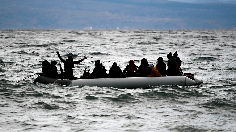 Migrants onboard a dinghy arrive at the village of Skala Sikaminias, on the Greek island of Lesbos, after crossing the Aegean sea from Turkey, Saturday, Feb. 29, 2020. Hundreds of refugees and migrant