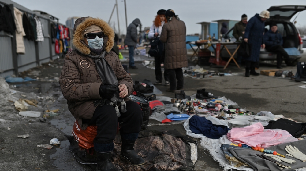 A vendor waits for customers at a flea market in Omsk