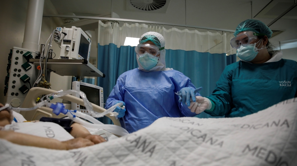Nurses take care of a patient suffering from the coronavirus disease (COVID-19) at an intensive care unit of the Medicana International Hospital in Istanbul, Turkey, April 14, 2020. Picture taken Apri