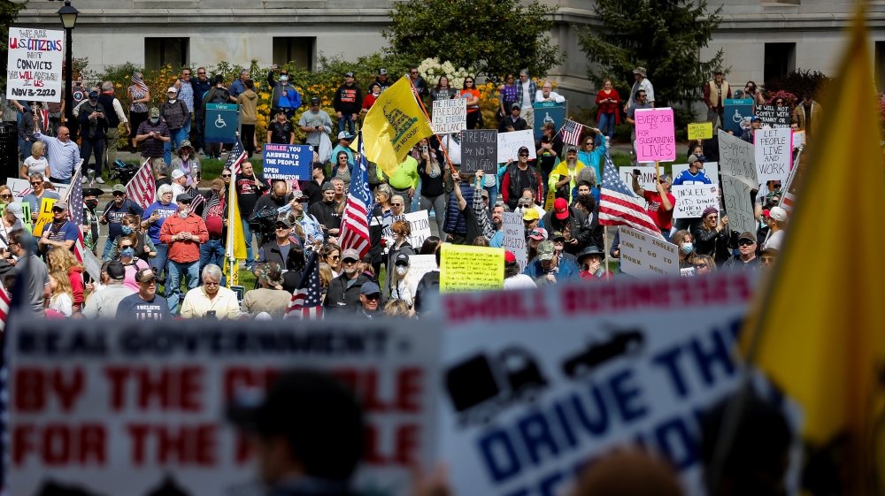 Protesters against the state's extended stay-at-home order demonstrate in Olympia