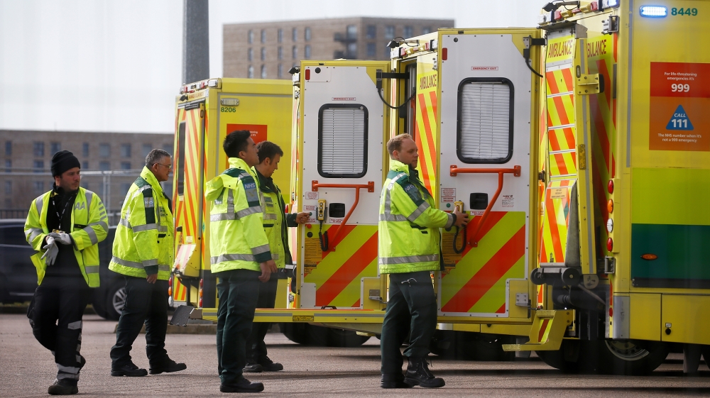 Paramedics and ambulances are seen outside the Excel Centre, London while it is being prepared to become the NHS Nightingale Hospital, as the spread of the coronavirus disease (COVID-19) continues, Lo