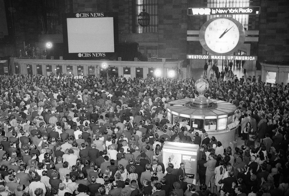 The time is 1:00 p.m. Est, and all eyes are focused on the television screen in Grand Central Station in New York City, April 17, 1970 watching for the safe landing of the Apollo 13 astronauts in the