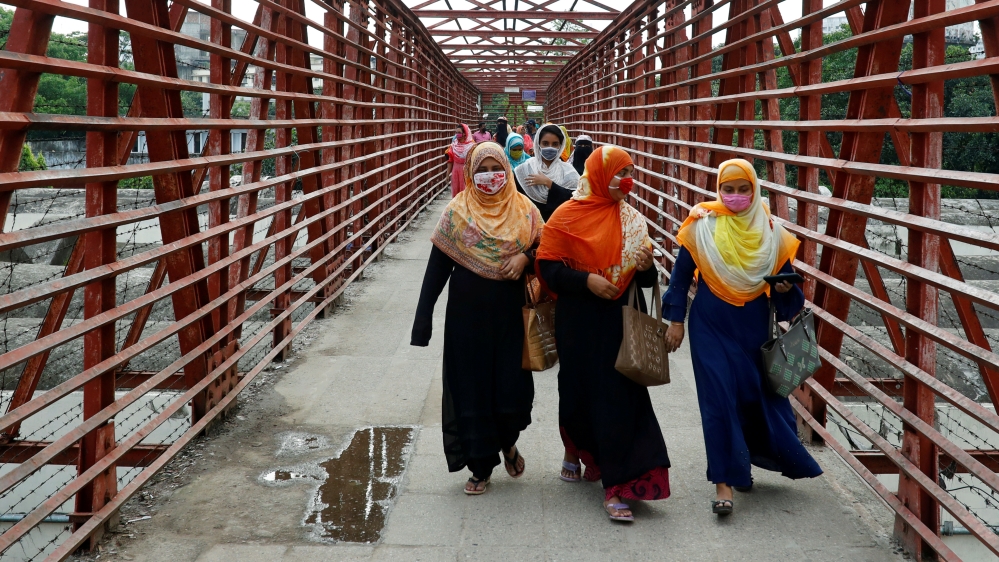 Garment workers return after their work as garment factories reopened amid concerns over the coronavirus disease (COVID-19) outbreak in Dhaka