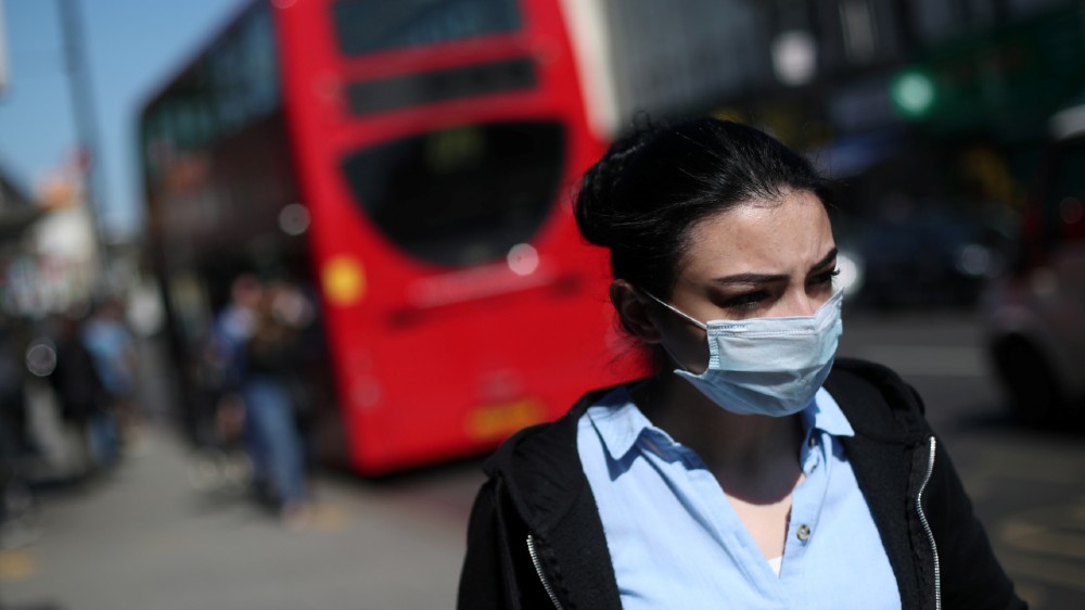 woman mask bus uk - reuters