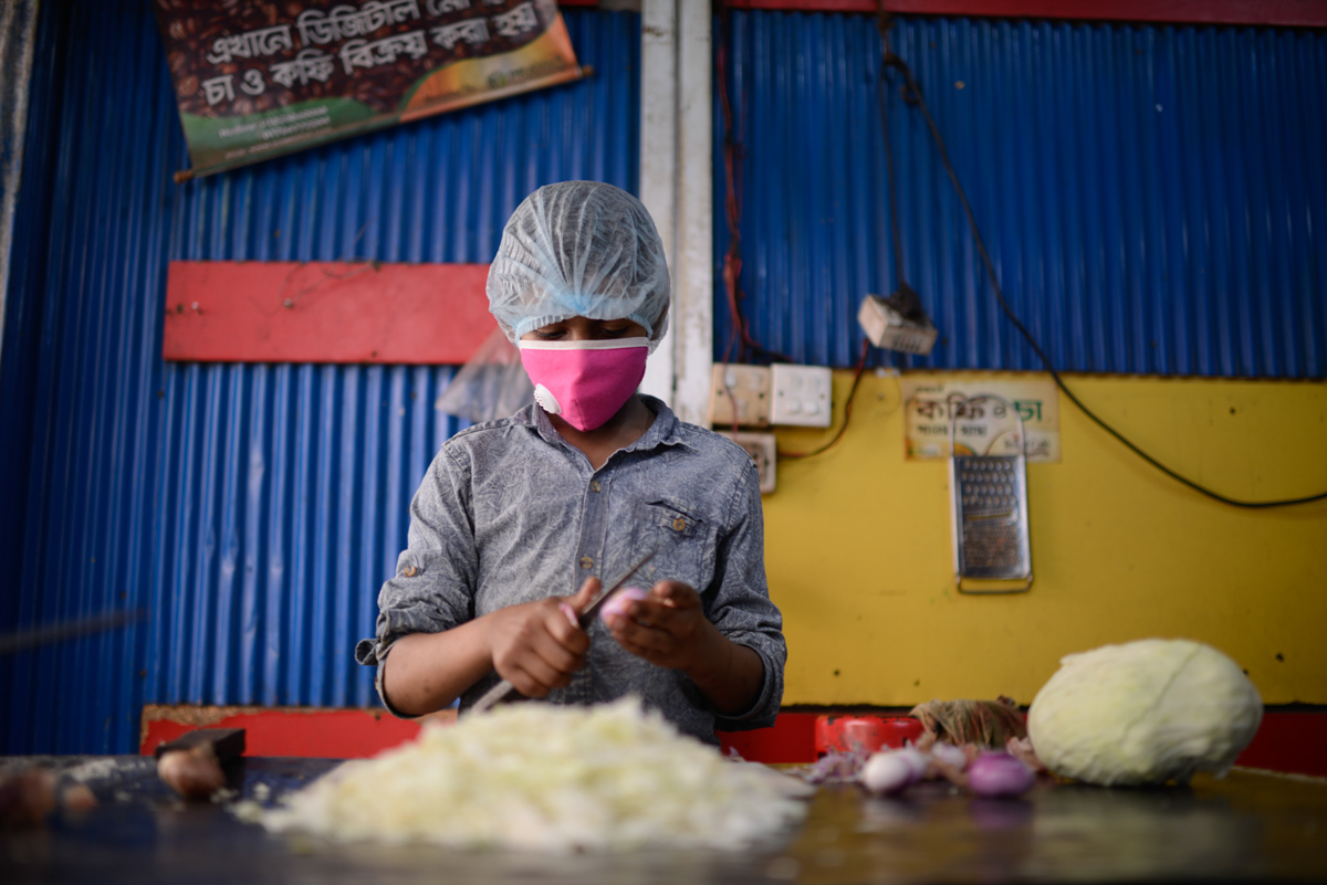 Palash works as a waiter at a restaurant in Kalachandpur, Dhaka. He was unable to go to his village when the holidays were announced. Mahmud Hossain Opu/ Al Jazeera