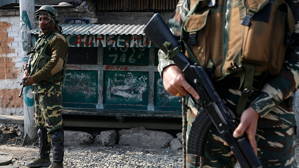 Indian paramilitary soldiers stand guard in Srinagar