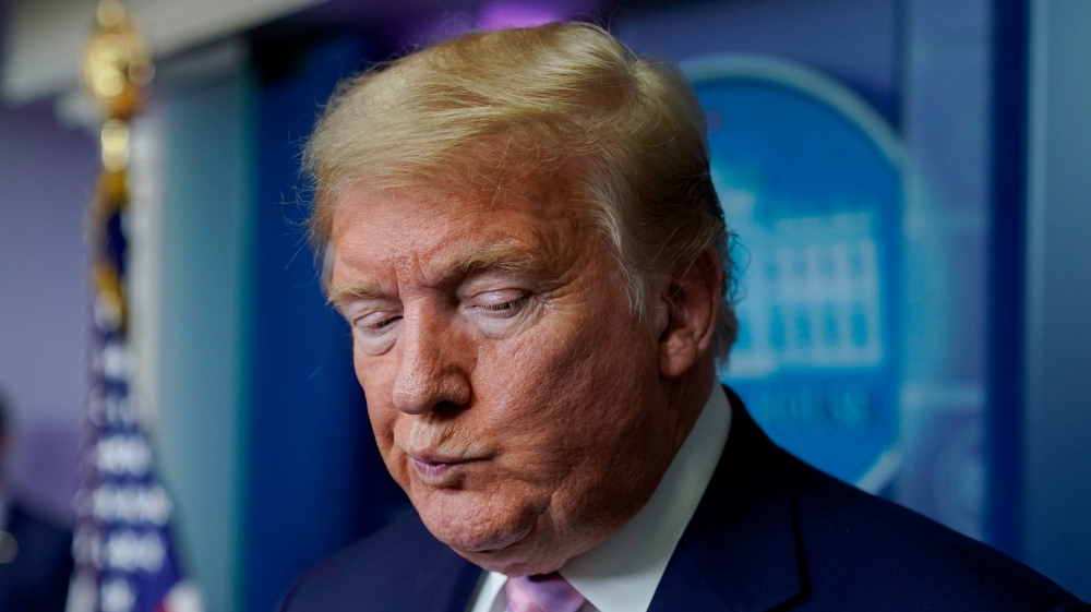 U.S. President Trump reacts to a question during the daily coronavirus response briefing at the White House in Washington