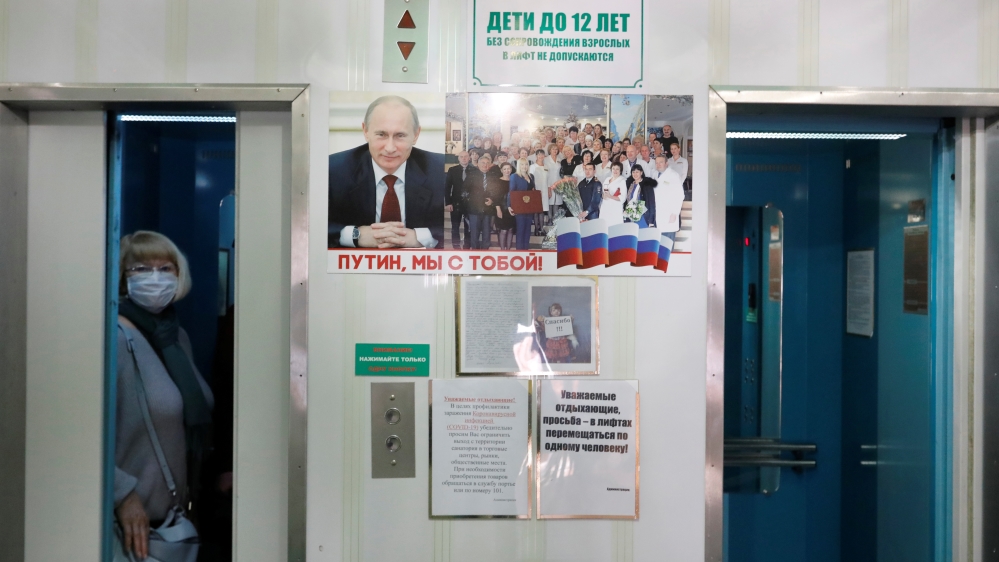 A journalist wearing a protective face mask is seen in an elevator in Pyatigorsk