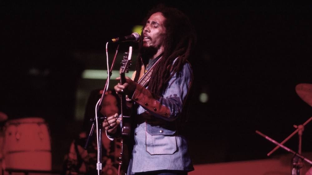 Jamaican Reggae musician Bob Marley (1945 - 1981) plays guitar as he leads his band the Wailers during a performance in the ''Uprising'' tour at Madison Square Garden , New York, New York, September 19,