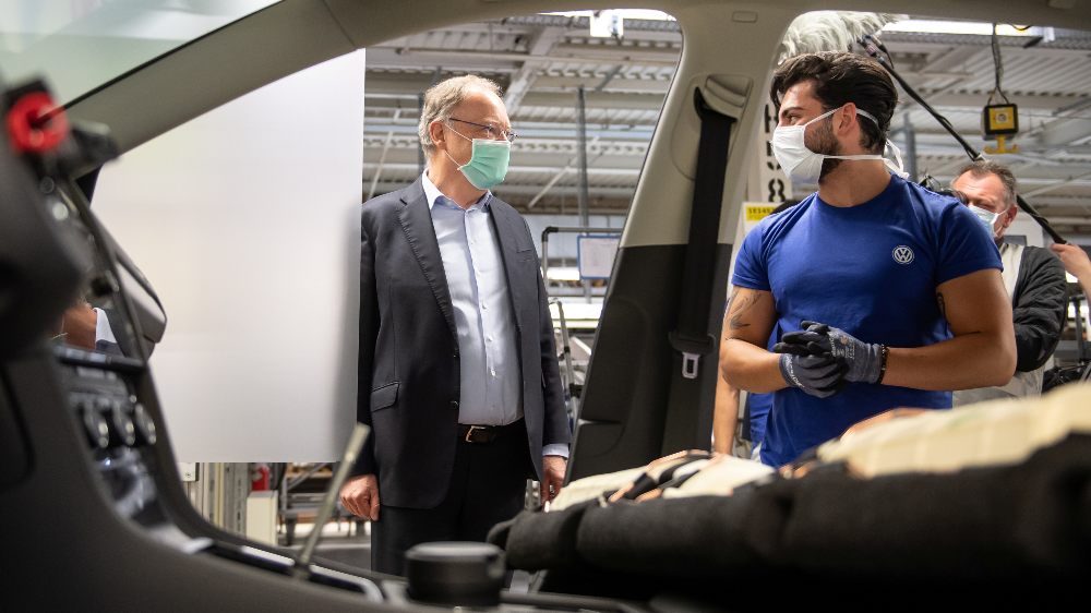 VW reopens factory - reuters