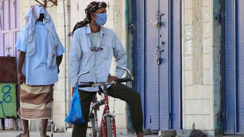 A man wearing a protecitve face mask rides a bicycle during a curfew amid concerns about the spread of the coronavirus disease (COVID-19) in Aden, Yemen April 30, 2020. REUTERS/Wael al-Qubati