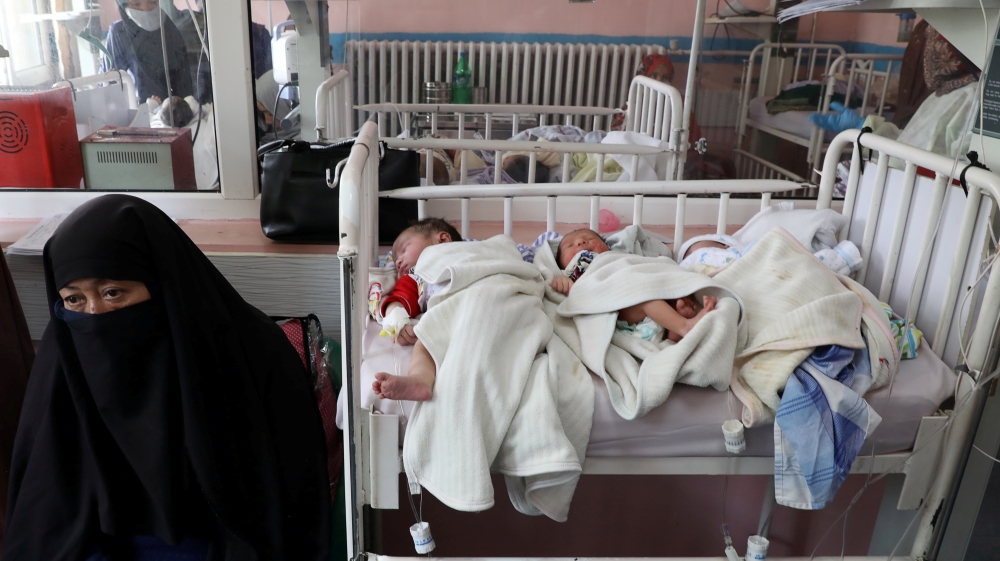 Newborn children who lost their mothers during the yesterday''s attack lie on a bed at a hospital, in Kabul