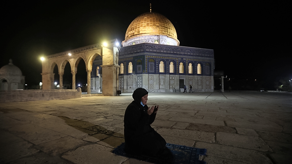 A muslim woman pray next to the Dome of the Rock Mosque in the Al Aqsa Mosque compound in Jerusalem''s old city, Sunday, May 31, 2020.The Al-Aqsa mosque in Jerusalem, the third holiest site in Islam, r