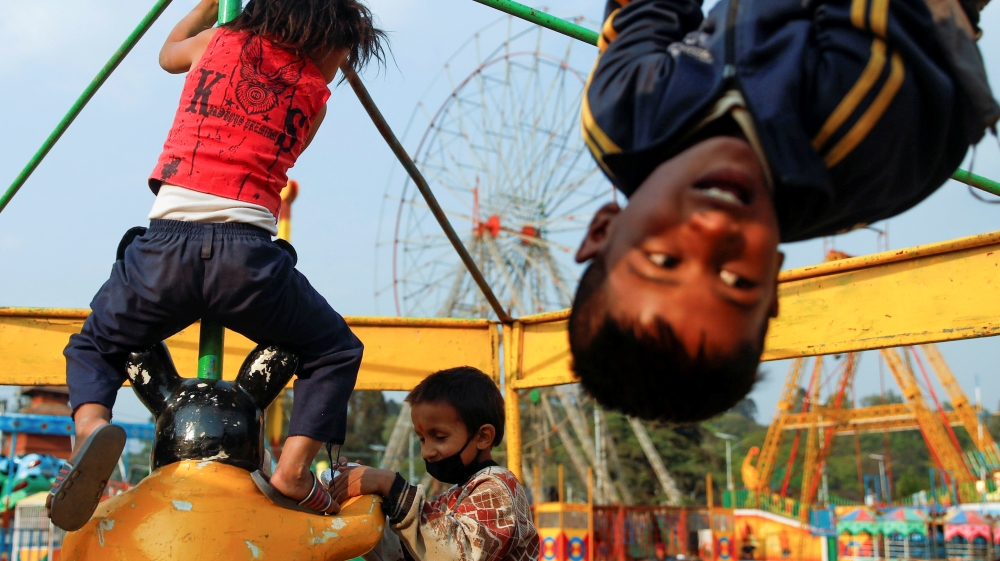 Children play at the closed amusement park during the thirteenth day of a lockdown imposed by the government amid concerns about the spread of the coronavirus disease (COVID-19), in Kathmandu