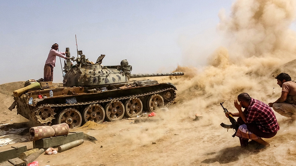 A tank belonging to forces loyal to Yemen's Southern Transitional Council (STC) separatists fires while on the frontline of clashes with pro-government forces for control of Zinjibar, the capital of t