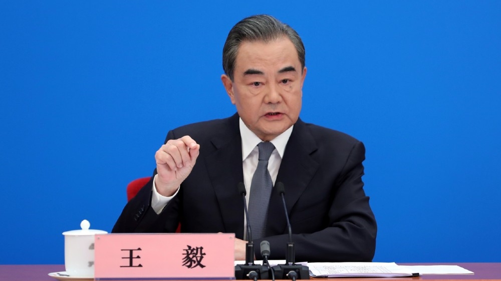Chinese State Councillor and Foreign Minister Wang Yi speaks to reporters via video link at a news conference held on the sidelines of the National People''s Congress (NPC),