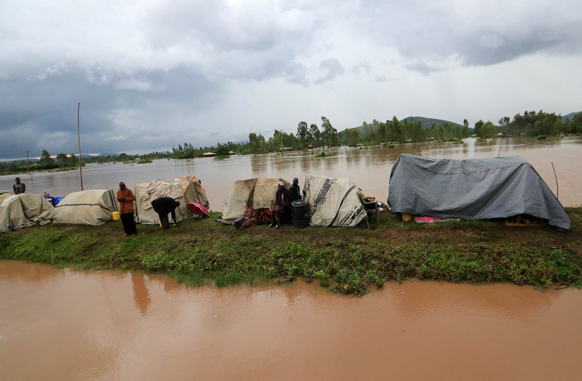 Residents set up makeshift shelter on a raised ground after they evacuated from their homes after River Nzoia burst its banks and due to the backflow from Lake Victoria, in Nyadorera, Siaya County, Ke