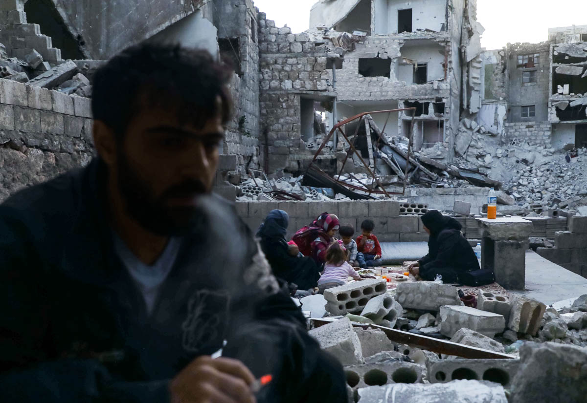 This picture taken on May 4, 2020 during the Muslim holy fasting month of Ramadan shows Tareq Abu Ziad (L), a displaced Syrian from the town of Ariha in the southern countryside of the Idlib province,