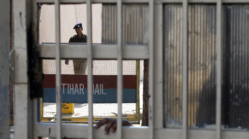 A policeman walks inside the Tihar Jail