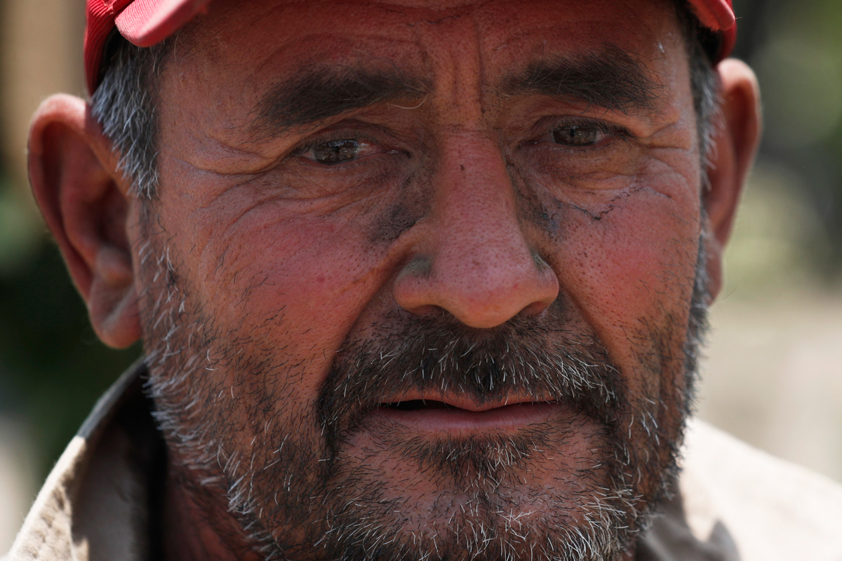 Melvin Sanaurio''s face is dirty after an hour of digging a grave at the San Lorenzo Tezonco Iztapalapa cemetery, where he has worked for 15 years, as he helps make space for more burials in a section