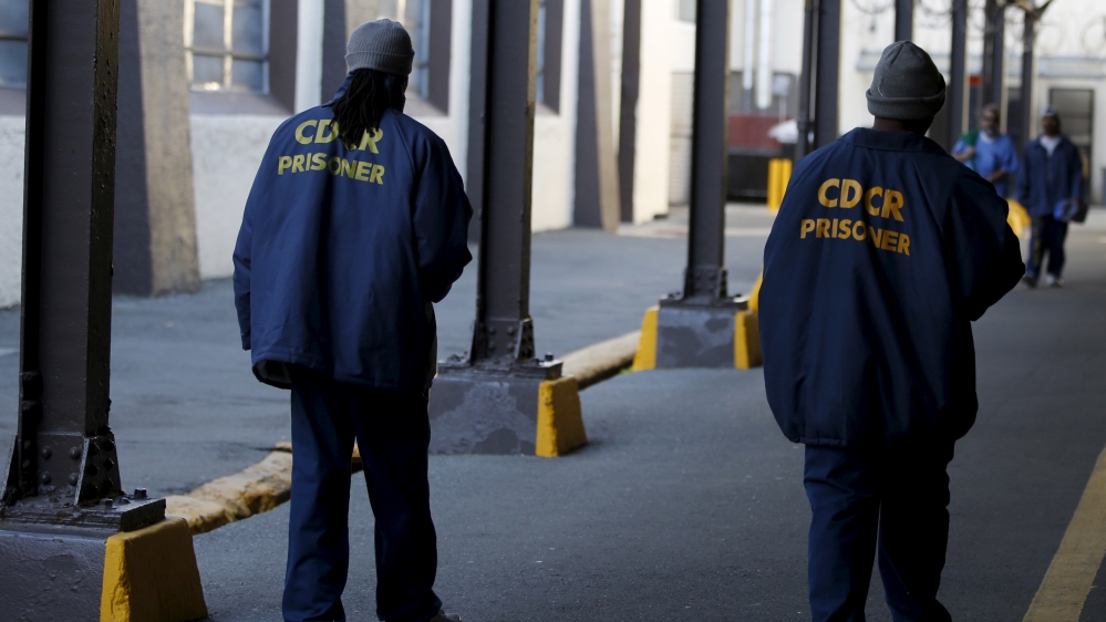Inmates walk in San Quentin State Prison in San Quentin, California