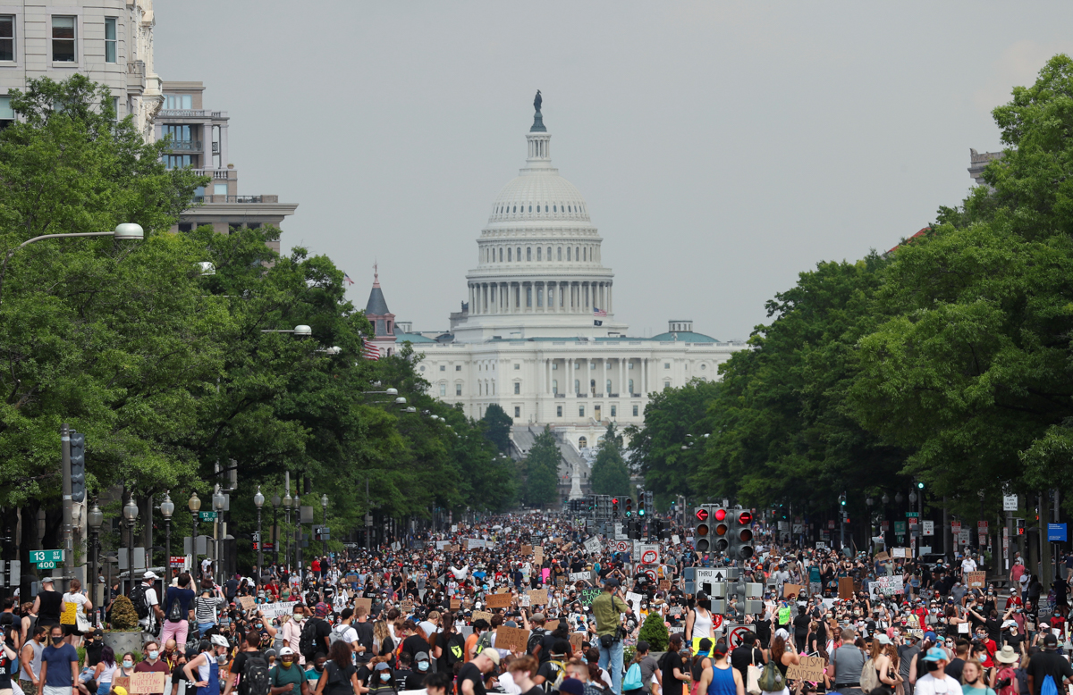 Demonstrators march from the U.S. Capitol Building during a protest against racial inequality in the aftermath of the death in Minneapolis police custody of George Floyd, in Washington, U.S., June 6,