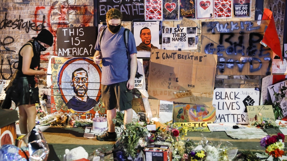 Protesters gather at a memorial for George Floyd where he died outside Cup Foods on East 38th Street and Chicago Avenue, Monday, June 1, 2020, in Minneapolis. Protests continued following the death of
