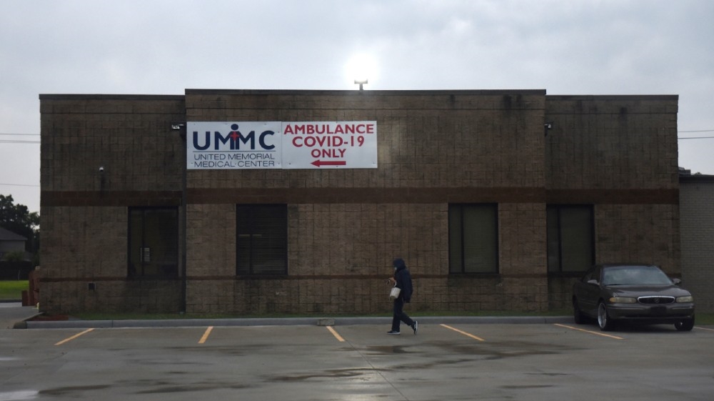 A person walks next to a coronavirus disease (COVID-19) testing site, which was closed due to inclement weather, in Houston, Texas, U.S., June 22, 2020. REUTERS/Callaghan O'Hare