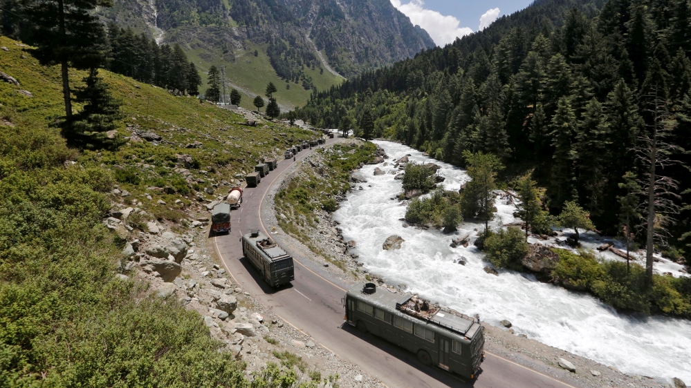 Indian Army convoy moves along a highway leading to Ladakh, at Gagangeer