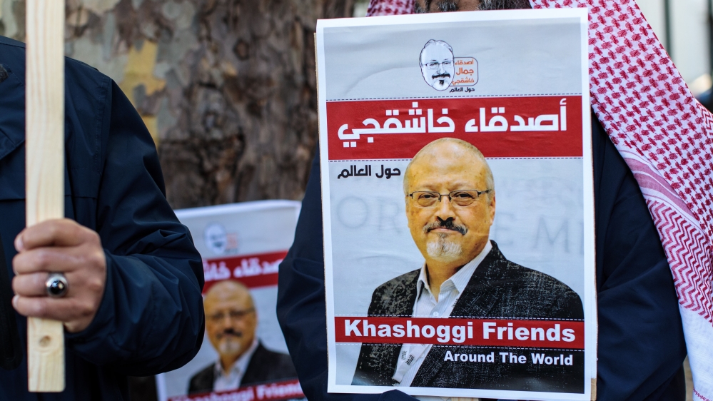 Protesters holding placards demonstrate against the killing of journalist Jamal Khashoggi outside the Saudi