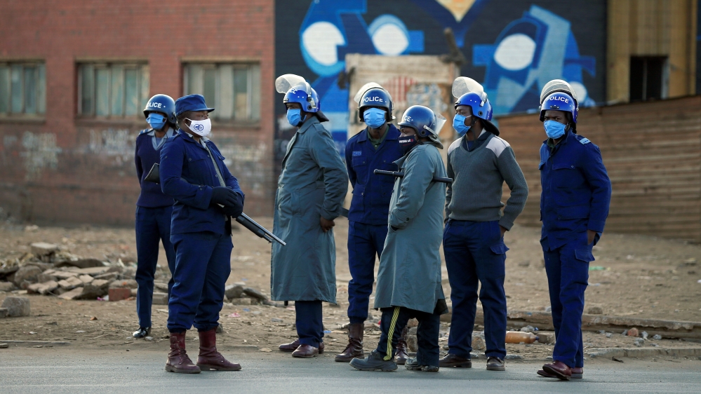 Police patrol the streets ahead of planned anti-government protests in Harare