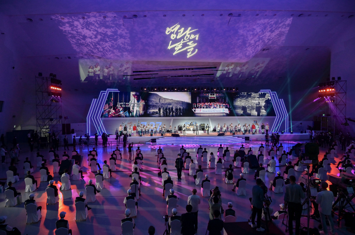A general view shows Korean War veterans and guests observing social distancing as they attend a UN Forces Participation Day event marking the anniversary of the signing of the Korean War armistice ag