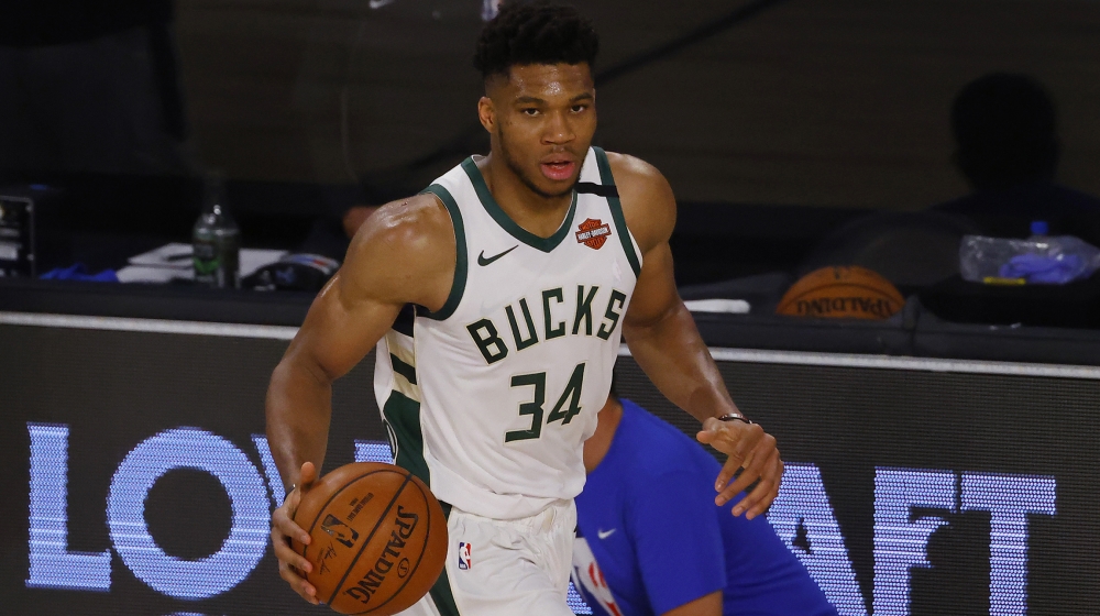 Lake Buena Vista, Florida, USA; Giannis Antetokounmpo #34 of the Milwaukee Bucks moves the ball up court against the Orlando Magic in Game Three of the Eastern Conference First Round during the 2020 N