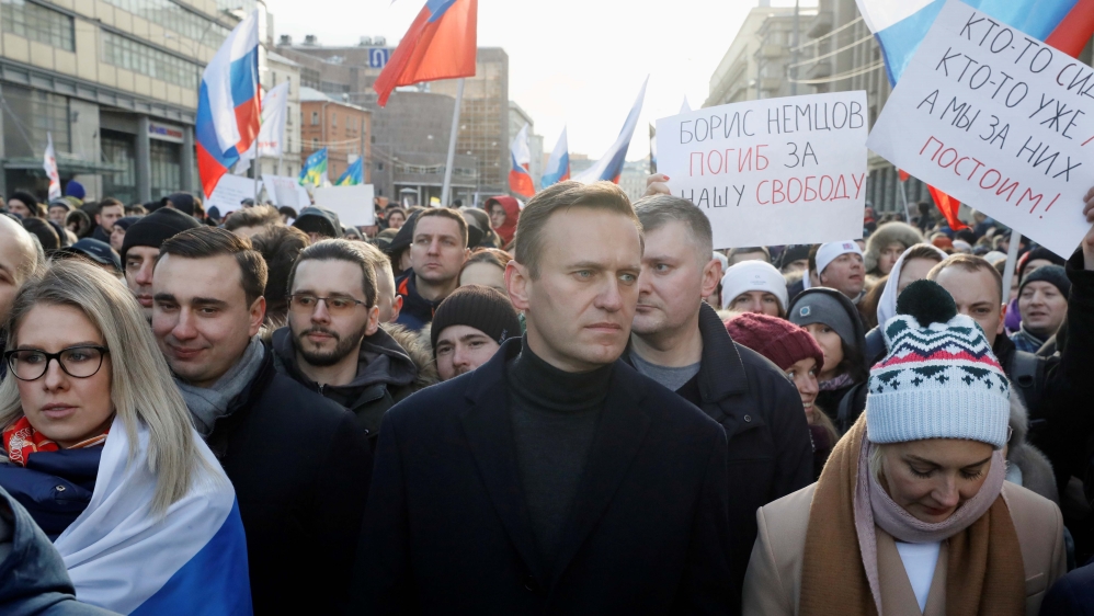 Russian opposition politician Alexei Navalny, his wife Yulia and opposition figure Lyubov Sobol take part in a rally to mark the 5th anniversary of opposition politician Boris Nemtsov''s murder