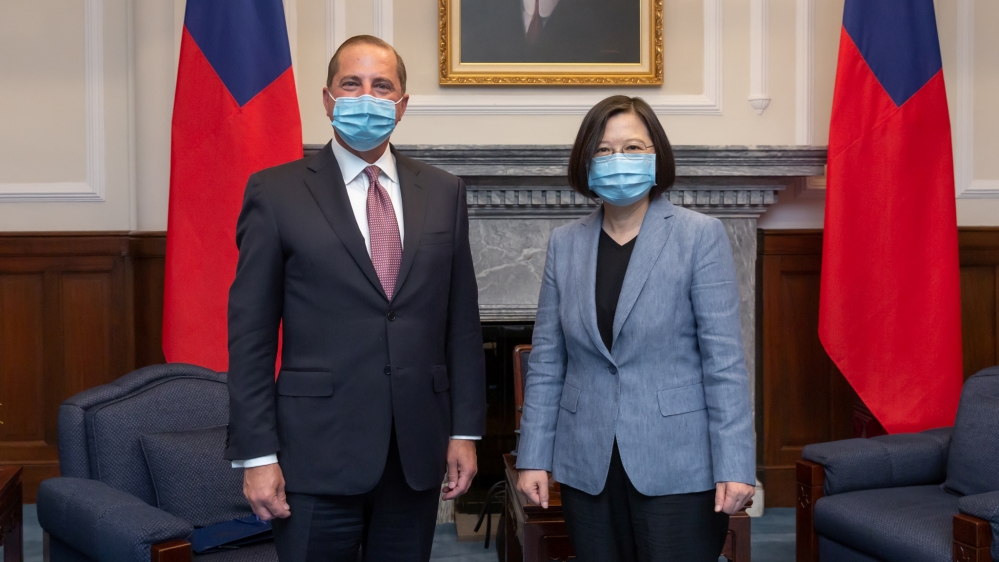 U.S. Secretary of Health and Human Services Alex Azar and Taiwan President Tsai Ing-wen, both wearing face masks, pose for photos during their meeting at the presidential office, in Taipei