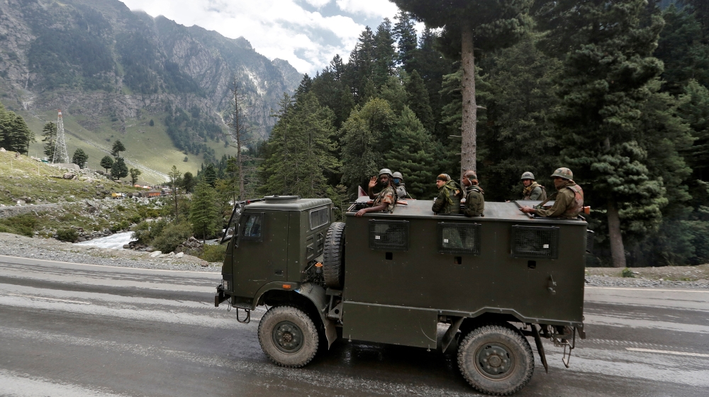 Indian army soldiers are seen atop a vehicle on a highway leading to Ladakh, at Gagangeer in Kashmir''s Ganderbal district September 2, 2020. REUTERS/Danish Ismail