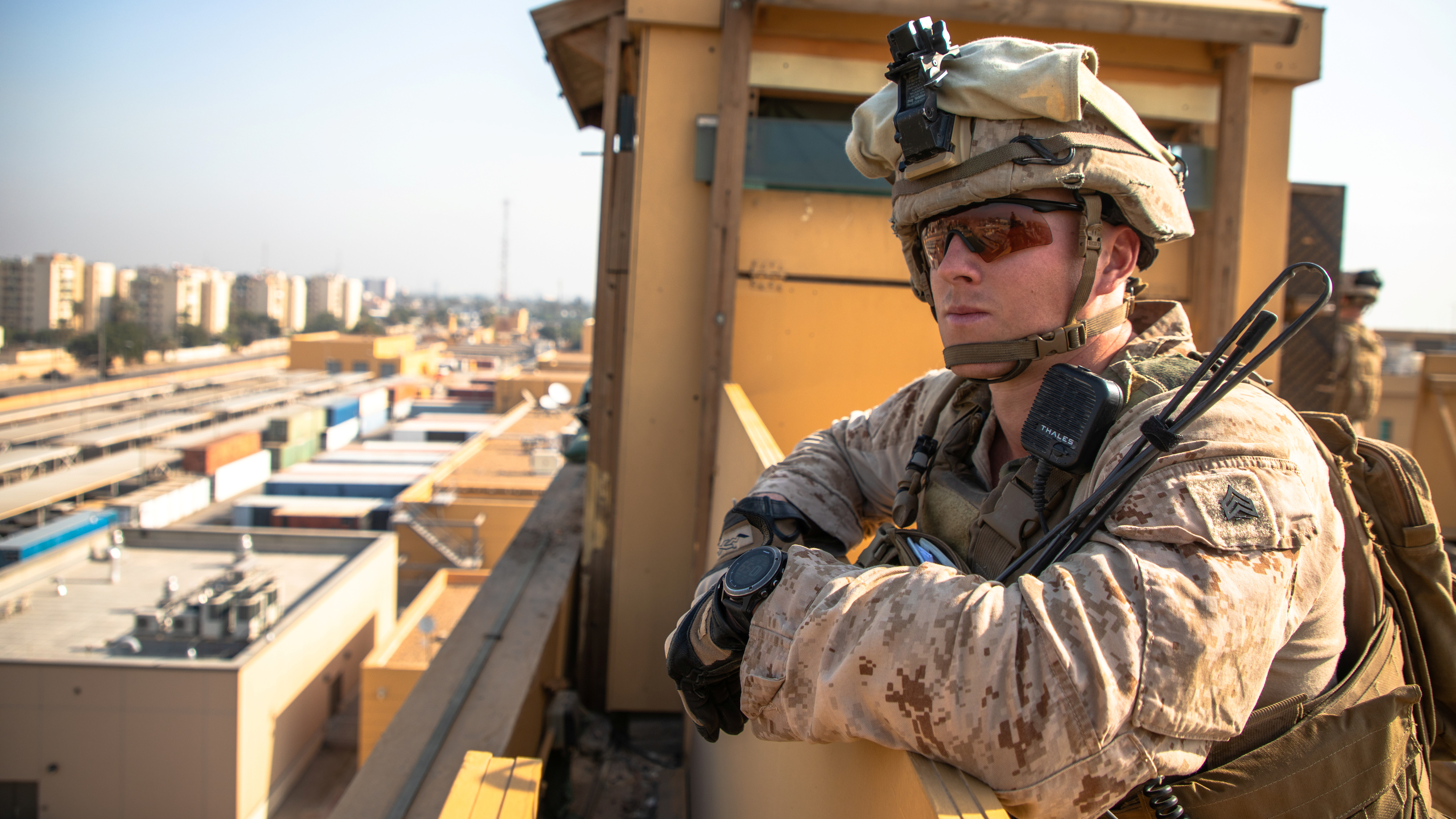 A U.S. Marine with 2nd Battalion, 7th Marines, assigned to the Special Purpose Marine Air-Ground Task Force-Crisis Response-Central Command (SPMAGTF-CR-CC) 19.2, supervises his squad as they provide over watch security at the U.S. embassy compound in Baghdad, Iraq, January 3, 2020.