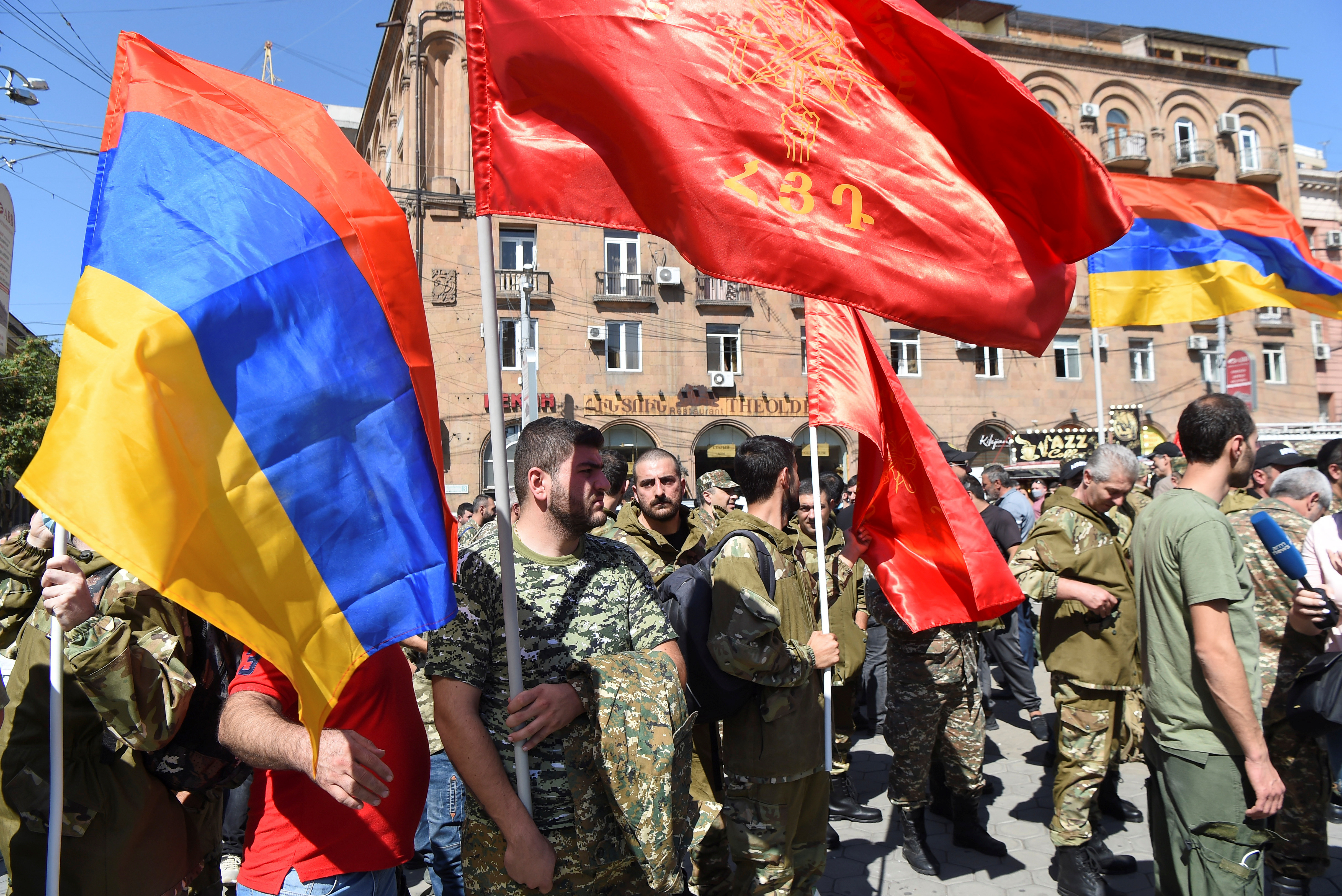 People attend a meeting to recruit military volunteers in Yerevan, Armenia [Melik Baghdasaryan/Photolure/Reuters]