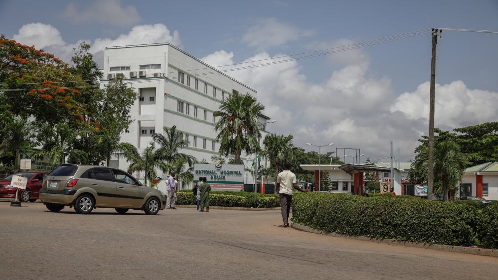 People are seen going into the National hospital after resident doctors commence a doctors strike, as coronavirus disease (COVID-19) infection continues to rise in Abuja